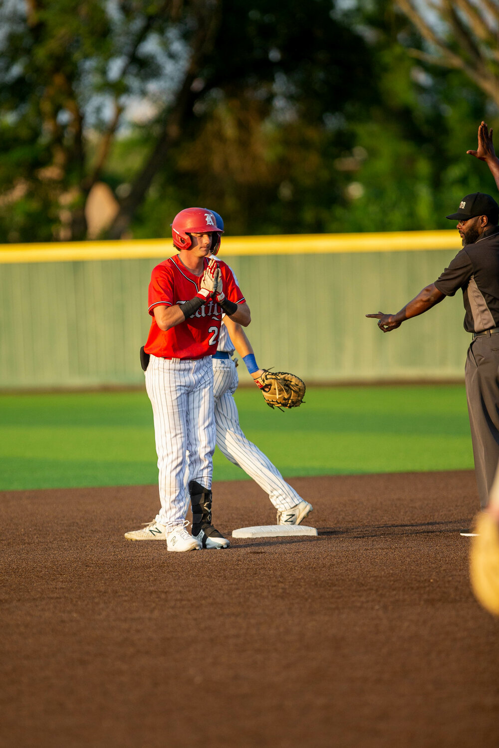 Sutton Hull celbrates after a hit during Wednesday's Regional Semifinal between Katy and Clear Springs at Deer Park.
